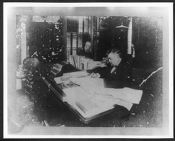 Elias Carr, Jr.  at desk of office in old Agricultural Building